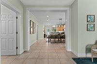 The home's living room is equipped with a large TV and several seating options.
| Emerald Palm by Boutiq Luxury Vacation Rentals | Miramar Beach, Florida
