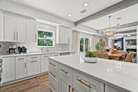 The half bath is located right across from the garage and provides a convenient and private space.
| White Sands by Boutiq Luxury Vacation Rentals | Destin, Florida