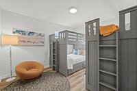 The downstairs bedroom has a king sized bed, ensuite bathroom, and desk.
| White Sands by Boutiq Luxury Vacation Rentals | Destin, Florida The downstairs bedroom has a king sized bed, ensuite bathroom, and desk.
| White Sands by Boutiq Luxury Vacation Rentals | Destin, Florida