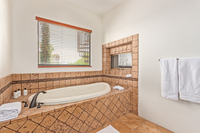 The primary bathroom features a double sink, walk-in closet, and a large, jacuzzi style tub, offering plenty of space and comfort for each person.
| The Sonoran by Boutiq Luxury Vacation Rentals | Scottsdale, Arizona