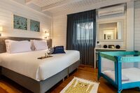 two bedroom cottage master bedroom at the magnolia hotel_wide